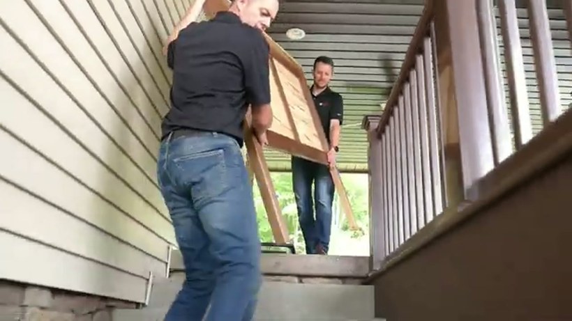 G & G Moving crew handling a piece on a Delaware job