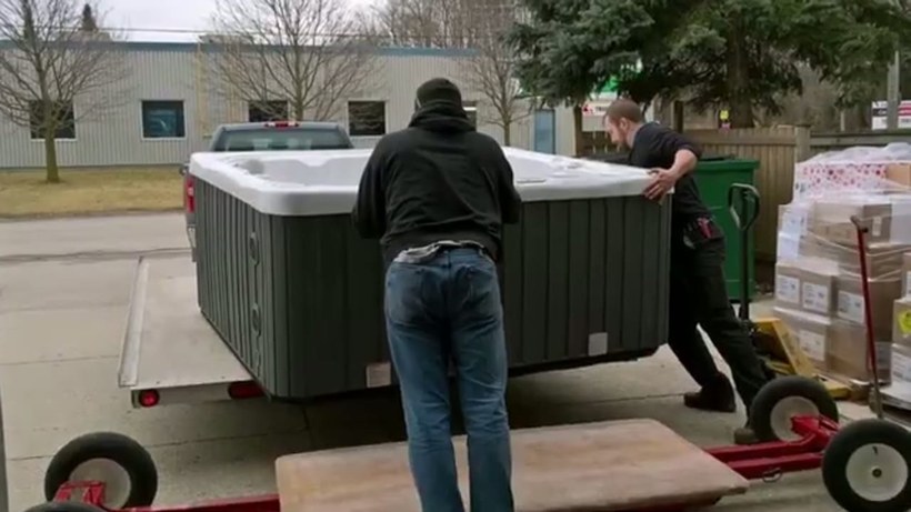 G & G Moving crew handling a piece on a Delaware job